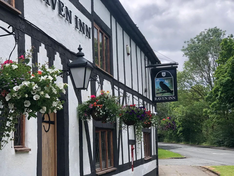 The red-brick frontage of The Raven Inn in Glazebury